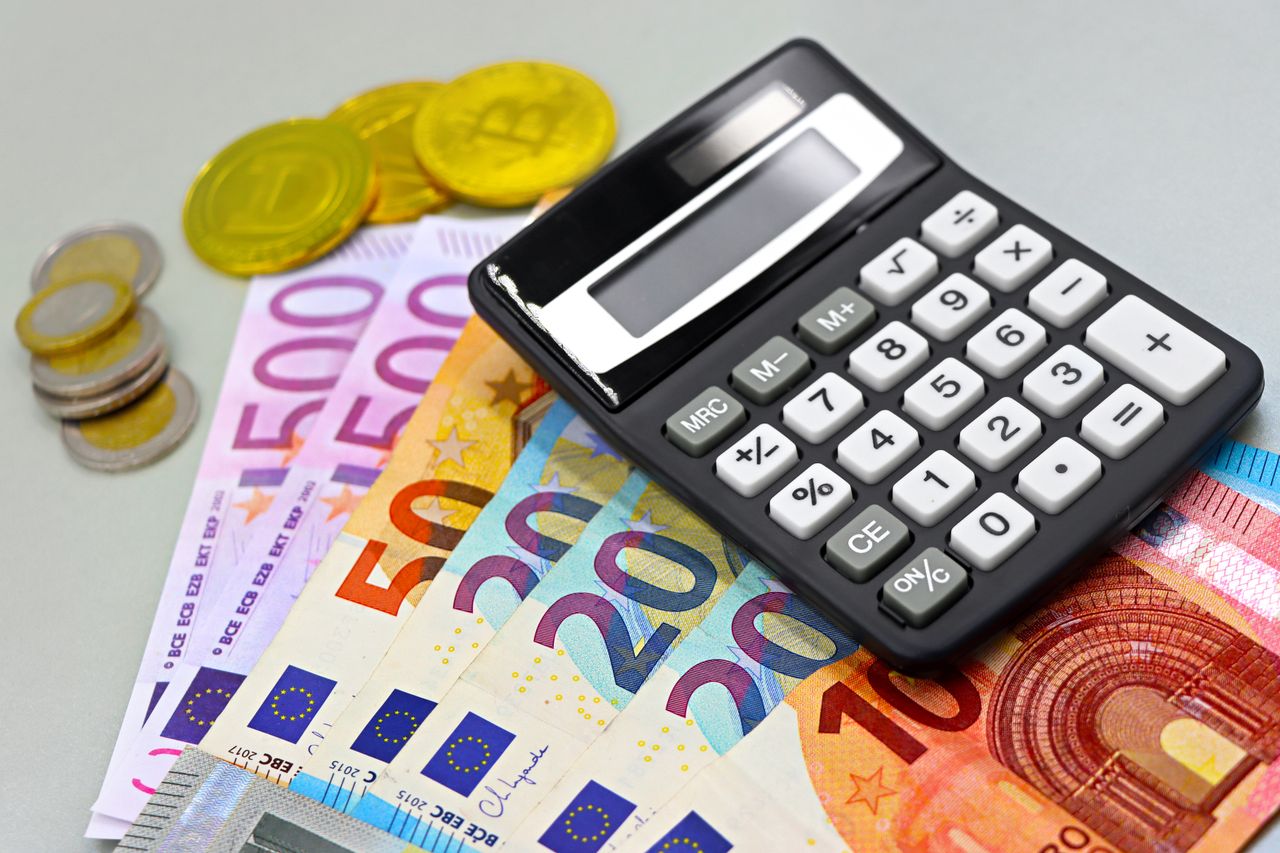 Services Image of euro banknotes, coins, and a calculator for financial planning. Perfect for finance themes.